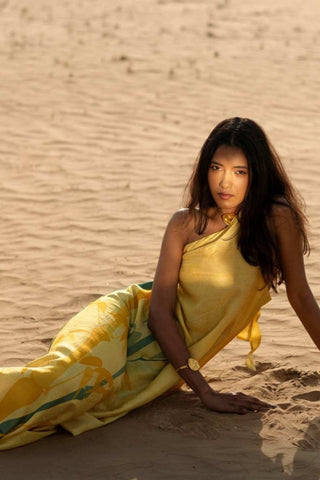 Model in Light yellow One-side off shoulder dress with bamboo prints posing for photoshoot made in rich dupion silk fabric. Ideal for vacation styling, brunch outfit, elegant summer dress.