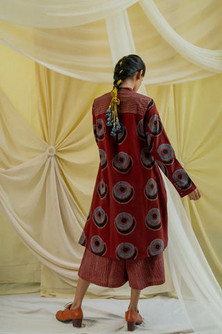 Back view of bias cut burgundy block print tunic with inverted pleat and printed culottes