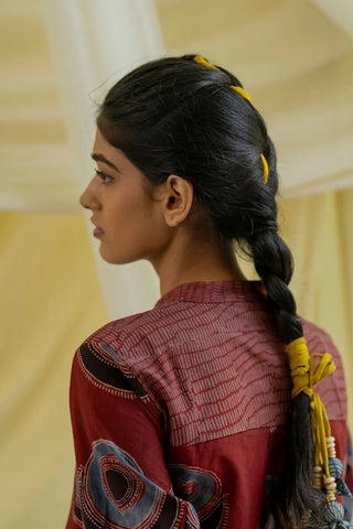 Back yoke detail of burgundy hand block printed Kawa tunic with contrast printed yoke