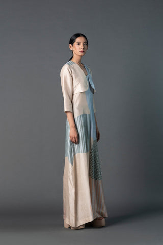Light and breezy pastel Bandhani jumpsuit with crop jacket in beige and blue, perfect for brunch or daytime gatherings.