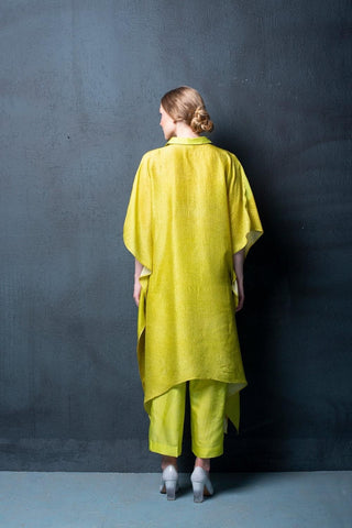 Back look of yellowish green dupion silk set featuring geometric abstract print kurta with asymmetrical hemline and parallel pants. Perfect for brunch, evening gatherings and daytime wear.