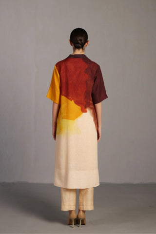 Back look of ochre and brown kurta set styled for daytime brunches, featuring short sleeves, wide collar, and straight pants, crafted in airy Korean linen with painterly colour application.