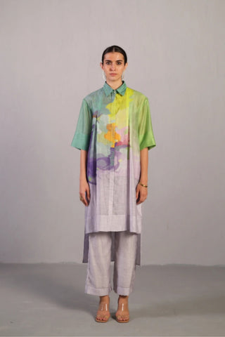 Front look of neon blue and green high-low modern kurta set with front pleats and point collar, artistic prints. Styled for creative office wear, travel and vacation wear, evening gatherings, offering a contemporary silhouette. Designed by clos.