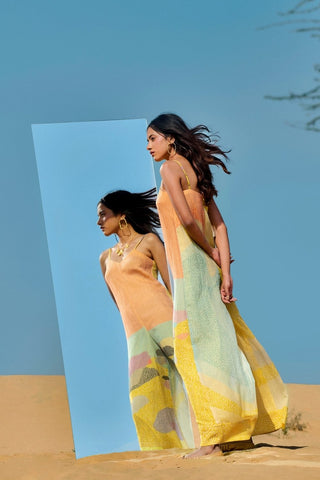 Women wearing abstract print thin strap jumpsuit styled for resort and vacation wear a lightweight, breathable feel, this modern jumpsuit is ideal for holiday evenings, beachside dinners.