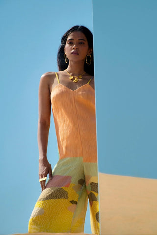 Close-up of abstract print detailing on women’s thin strap jumpsuit designed in-house. Showcasing artistic patterns and smooth fabric texture, this contemporary printed jumpsuit reflects modern design aesthetics.