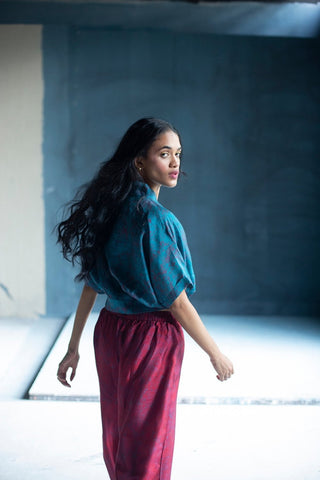 Model wearing dupion silk miniature floral print blouse with coordinated parallel pants, contemporary Indian fusion outfit. Perfect for casual outings, brunches, summer wear. Designed by Clos. 
