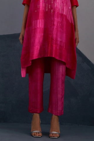 Fuchsia pink dupion silk straight trousers coordinated with statement tunic.
