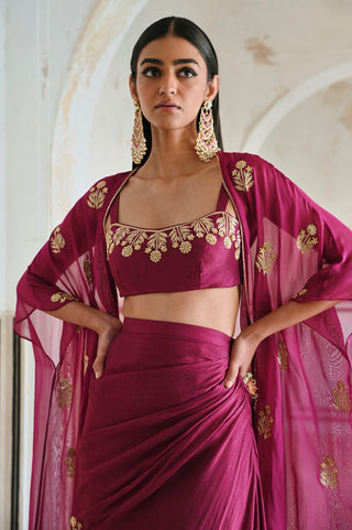 Chic Indo-western three-piece outfit with magenta floral embroidery — includes a statement bralet, jacket, and flowing cowl skirt perfect for celebrations and bridal wedding receiption, cocktain party or hens party.