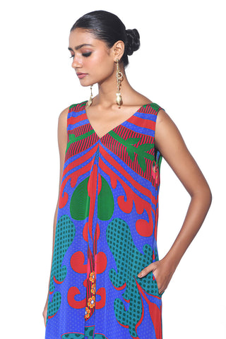  Close up of Electric Blue Royal Paisley Wide-Leg Jumpsuit by designer Siddharth Bansal, featuring vibrant ethnic prints, structured pleats, and flowing wide-leg pants - blending tradition with contemporary fashion.