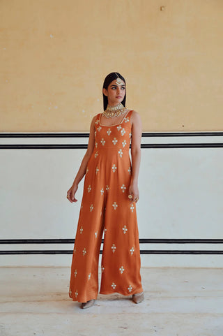 Copper floral butti embroidered jumpsuit featuring a square neckline and flared silhouette, offering an elegant modern ethnic look for women’s festive and occasion wear.