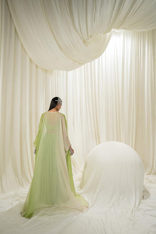 Back view of lime jacket set highlighting the flowing sharara and detailed embroidery on the jacket.