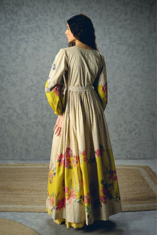 Back look of ivory floral Elena Dress crafted from breathable poplin with statement yellow floral accents, puff sleeves, and a tailored silhouette. Designed with a fitted chest and waist, this feminine dress is ideal for festive celebrations and daytime elegance.