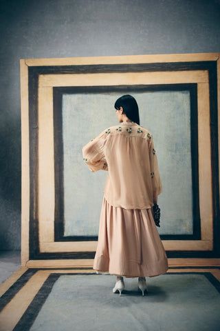 Stylish nude co-ord set with subtle prints, an embroidered shirt, coordinated bustier, and pencil skirt. A polished yet comfortable look ideal for casual outings or daytime gatherings.