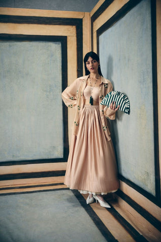 Elegant nude printed set featuring a detailed embroidered shirt, structured bustier, and sleek pencil skirt. Designed for effortless sophistication and modern styling for daywear events.