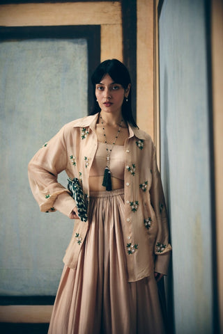 Elegant nude printed set featuring a detailed embroidered shirt, structured bustier, and sleek pencil skirt. Designed for effortless sophistication and modern styling for daywear events.