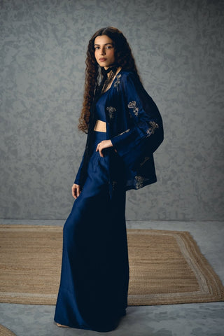 Stylish navy blue co-ord set crafted in pure silk with a bustier and pants, complemented by a minimal embroidered bell-sleeve jacket for a sophisticated and contemporary look.