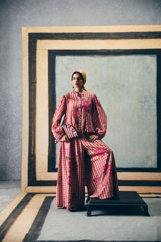 Pink gingham checks godet shirt paired with matching printed pants, creating a playful and coordinated look. A light and stylish outfit perfect for casual outings and effortless daywear styling.