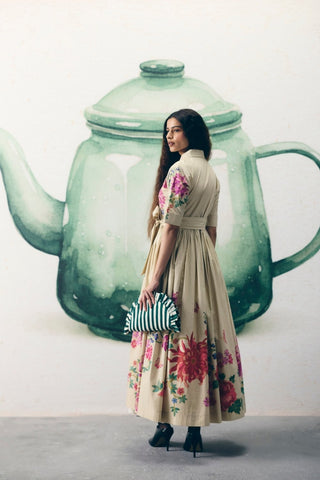 Back look of ivory poplin dress highlighting clean silhouette and refined contemporary styling.