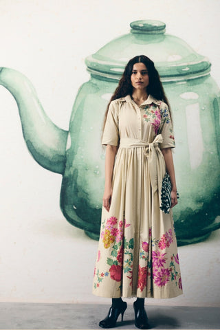 Moonflower ivory collared dress in poplin fabric featuring floral placement print, embroidered collar, and matching tie-up belt. Perfect for brunch outings, vacation styling, daytime occasions, and casual wear.