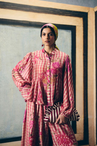 Playful pink gingham co-ord set featuring a flowy godet shirt and matching printed pants. A fresh and vibrant outfit designed for relaxed yet polished everyday fashion.