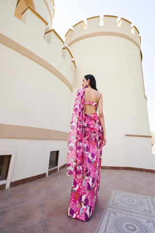 Back look of Ease fuschia floral printed pre-stitched saree paired with a matching Silk blouse, an effortless contemporary look for festive occasions and celebrations.