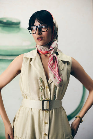 Minimal ivory dress with a classic collar, fine yoke embroidery, and a tie-up belt for shape. A graceful and airy outfit choice for summer styling, casual wear, or understated elegance.