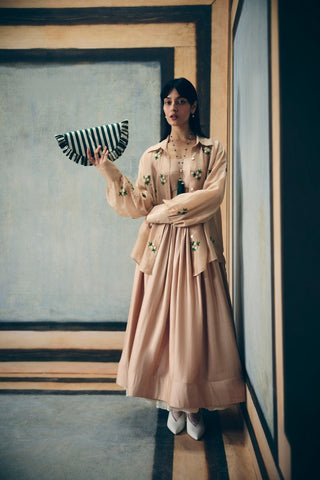 Minimal nude printed outfit with an embroidered shirt layered over a matching bustier and pencil skirt. A refined ensemble that blends elegance and versatility for day-to-evening wear.