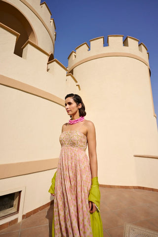 Model styling the pink and lime green printed geometric Anarkali set paired with its matching flowing dupatta for wedding festivities.