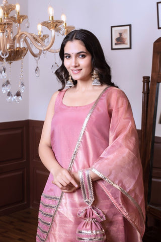 Model wearing Ghazal peach taffeta silk kurta set with golden patti work, women’s designer ethnic outfit styled for festive occasions and traditional celebrations.