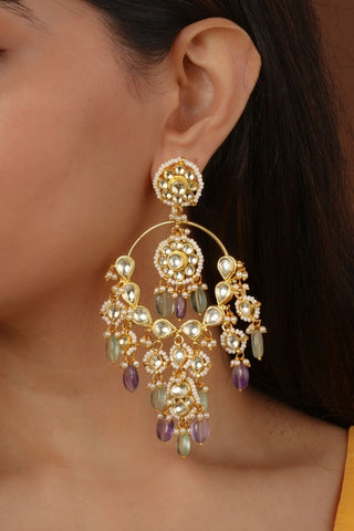Elegant gold-plated earring set featuring intricate traditional design, perfect for weddings, festive occasions, and ethnic wear with a timeless handcrafted appeal.
