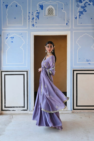 Elegant lilac floral butti embroidered floor-length Anarkali with V-neckline, full sleeves, and coordinated dupatta for engagement or reception wear.
