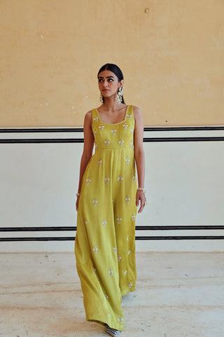 Lime flared jumpsuit with square neckline and floral butti embroidery, creating a contemporary ethnic look for festive celebrations, parties and special occasions.