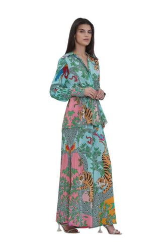 Left-side view of the luxury resort co-ord set highlighting the cinched waist, detailed placement prints, relaxed flared silhouette trousers, and chic Indo-western summer look.