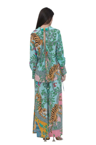 Back view of the resort-style women's co-ord set with an open-back tie-up design, shell tassel detailing, and printed flared trousers — a perfect vacation, brunch, and destination wedding outfit.