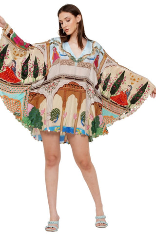 Luxurious kaftan printed with artwork inspired by Indian miniature paintings, embellished with hand-cut rexine coins for a touch of artisanal elegance. Designed by Limerick.