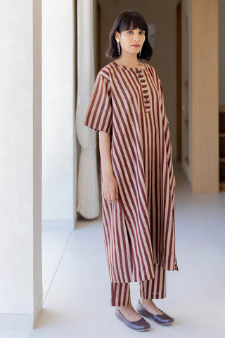 Model wearing maroon and beige striped cotton kurta with button placket and matching pants, front view