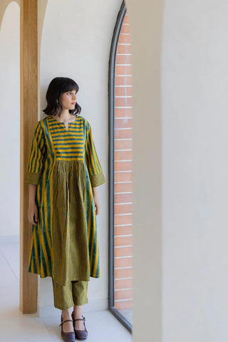 Full-length view of mustard and green stripe 4 panel cotton kurta with gathered yoke and matching pants