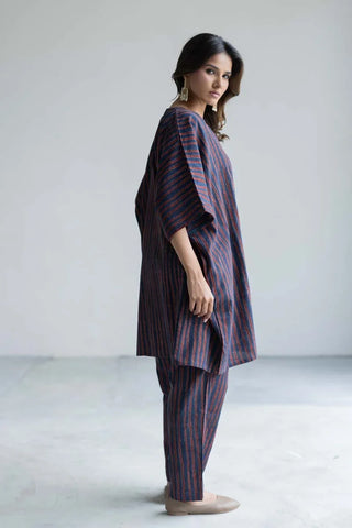 Side view of oversized navy striped cotton kaftan top with straight-cut pants