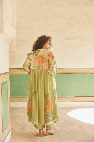 A pastel green and ivory placement jacket set from back.