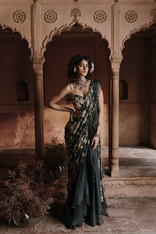 Women’s navy blue pre stitched saree featuring bird print with hand embroidered pallu and blouse, stylish ready to wear saree ideal for festive occasions, weddings, and evening events. Designed by Paulmi and Harsh.