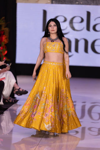 Yellow haldi lehenga set with pink, jari embroidery by Paulmi & Harsh, perfect for a bride’s Haldi ceremony and wedding celebrations.