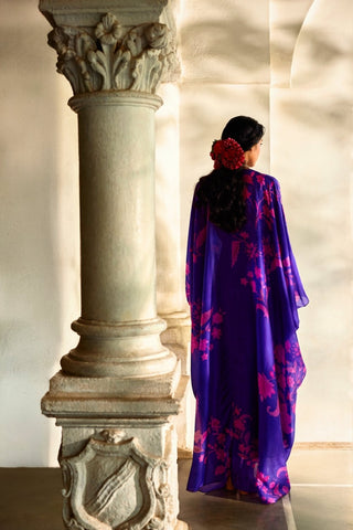 Breezy printed kaftan in rich purple tones with artisanal embroidery and elegant vacation-ready styling.