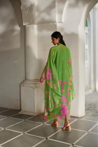 Breezy floral kaftan ensemble showcasing embroidered neckline work, hand-tucked tassels, and sophisticated festive appeal.