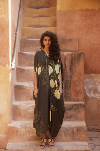 Floral habutai silk kaftan with airy silhouette and knot detailing, styled with a solid black slip — perfect for beach vacations and luxury resort wear. Designed by Paulmi and Harsh.
