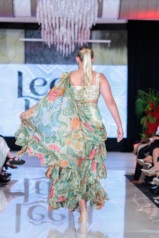 Back look of green floral chiffon saree with pre-draped styling and detailed lace embroidery.