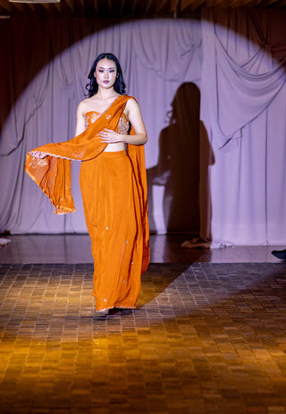 Model draped in delicate organza pre-draped saree, with hand-embroidered all-over buttis and scallops at Australian Fashion Grandeur.