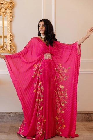 Rani printed leheriya kaftan with floral placement print on both sides and an embroidered patch in the middle. It is flowy, festive and beautiful. Designed by Paulmi and Harsh.