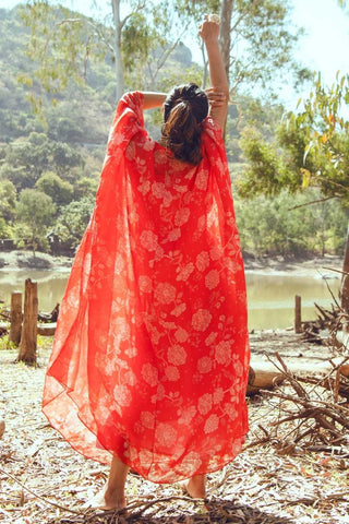 Back look of red chintz print kaftan featuring a hand-embroidered patch at the center, designed in a free-size, easy-to-wear silhouette with a relaxed and flowing fit.