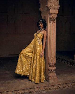 A self-woven Russian jacquard jumpsuit in a beautiful shade of yellow. It has delicate hand-embroidery of floral motifs on the pockets and yoke. Designed by Paulmi and Harsh