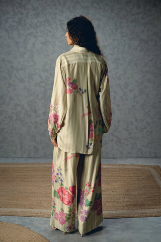 Aika relaxed shirt and trouser outfit featuring front-button styling, pleated pants and delicate floral stripes for an effortless contemporary daytime look.